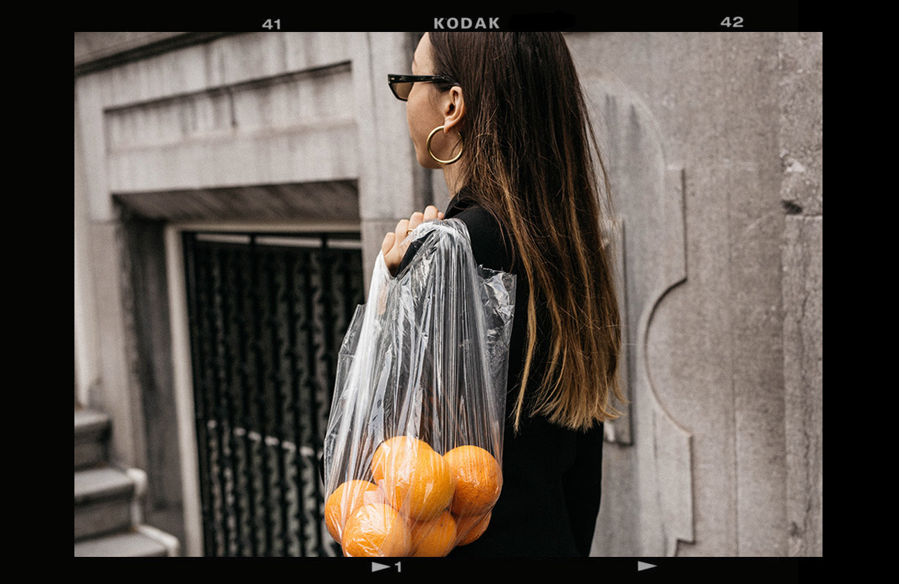 conceptual-editorial-outfit-ideas-balenciaga-sunglasses-2018-trend-black-tuxedo-dress-oranges-in-plastic-bag-2
